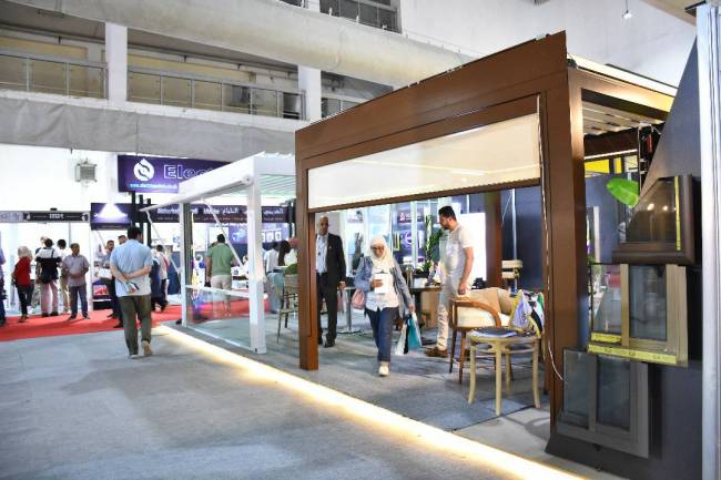 ناتورال لسحب الألمنيوم تعرض أحدث منتجاتها في معرض بيلدكس  الخطيب : أعدنا العمل بمنشأتنا في ريف دمشق بعد التحرير مباشرة ونجهز مصنع لإنتاج المفروشات سيفتتح بعد 6 أشهر 